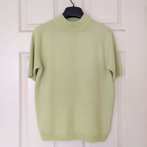 Woman's Short sleeve knit sweater with 1 1/2" neck.